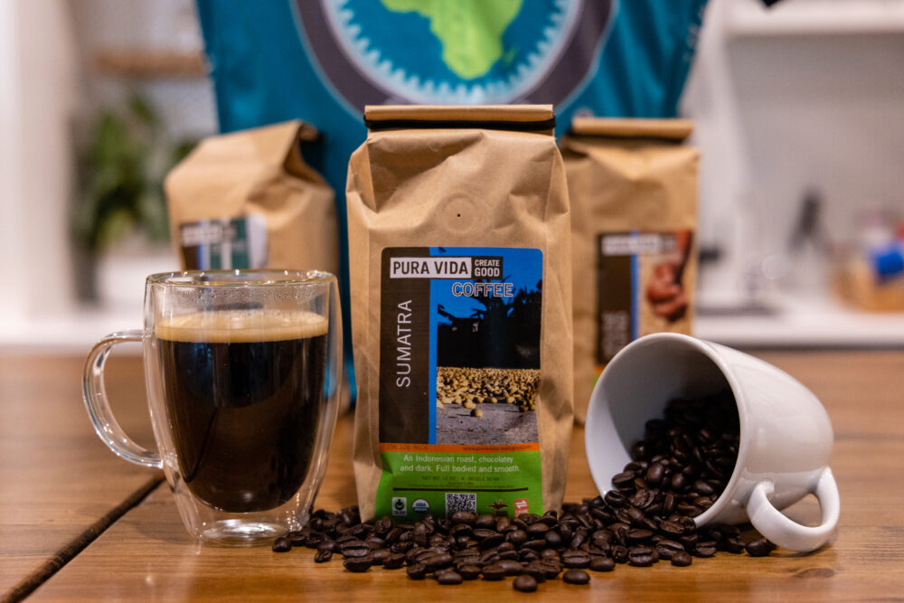 Picture of Pura Vida coffee beans and cup of coffee than can be purchased to support a cyclist